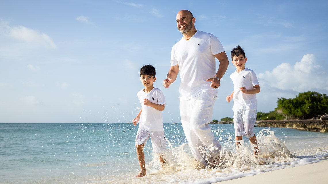 eagle beach running father and sons
